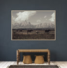 Framed landscape print of horses in a field with mountains on a dark blue wall above a wooden console table - Your Western Decor