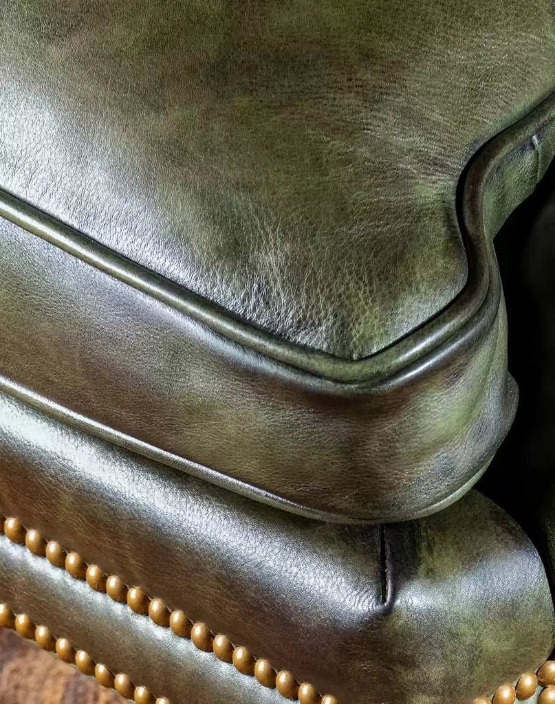 Olive green leather chair seat corner detail - Your Western Decor