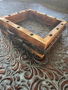 Handmade wood box for cowhide coasters with handmade embossed leather belt, black buckle, and luxury embossed leather inside, with black nail trim accents 