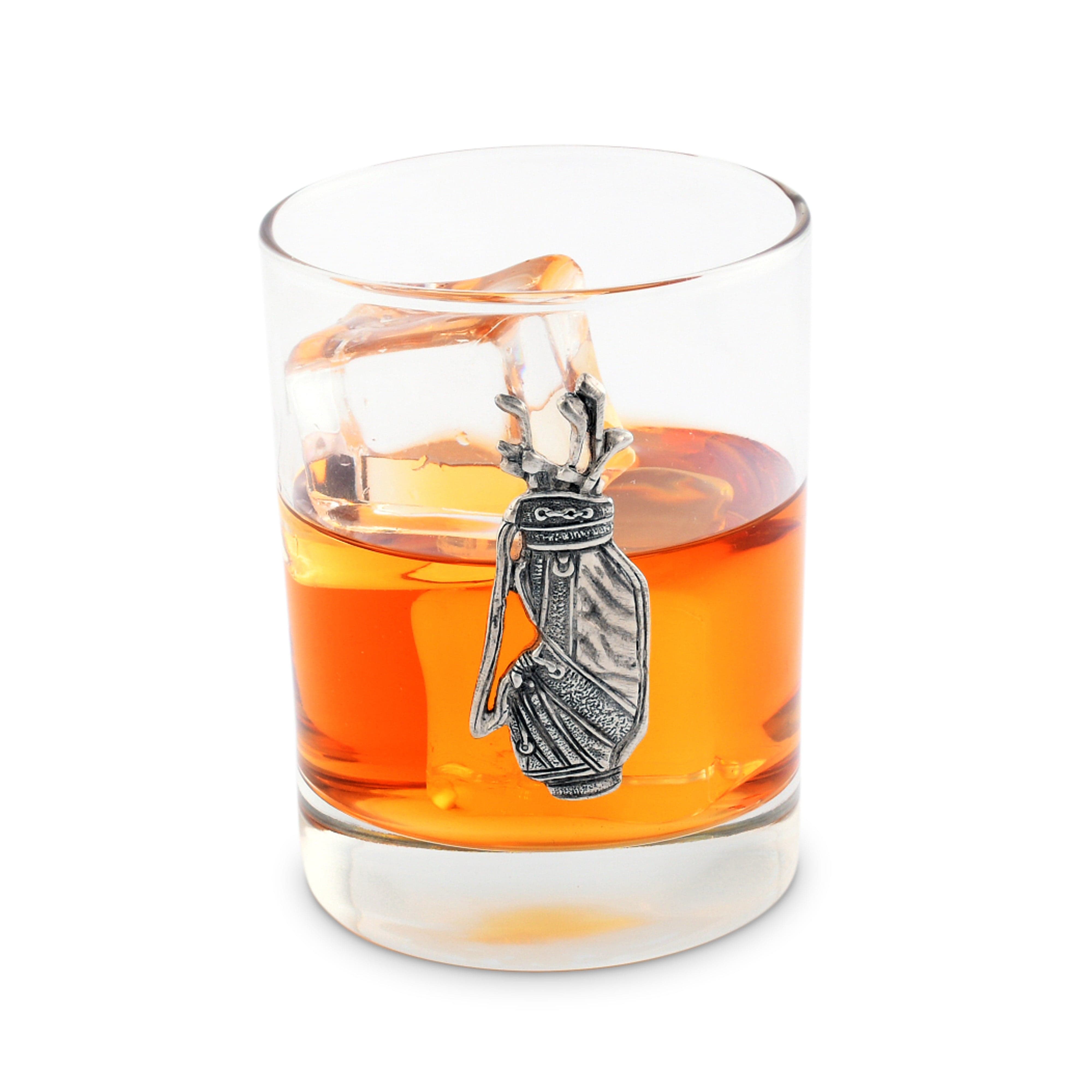 Glass with orange liquid and a golf bag design with ice cube on a white background