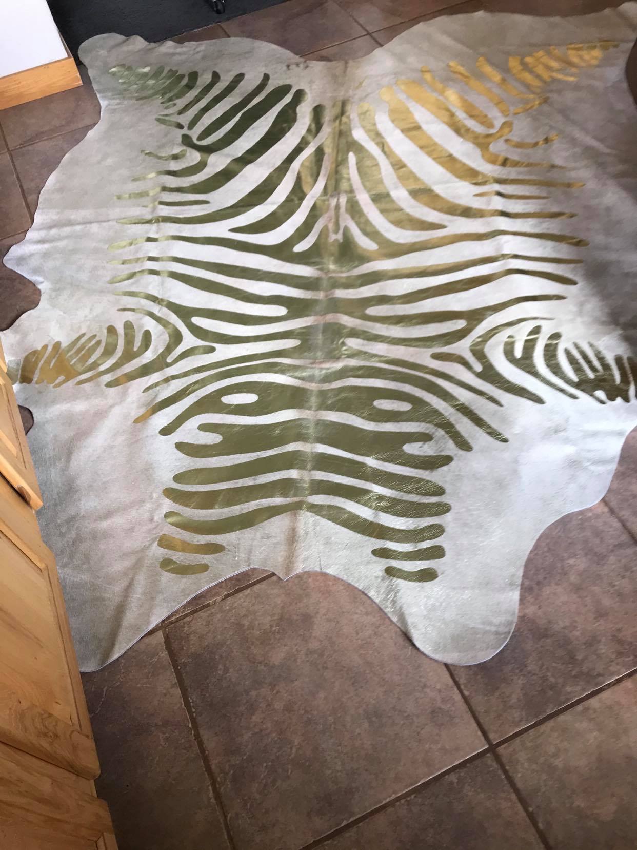 Gold stenciled zebra on beige cowhide rug - Your Western Décor & Design 