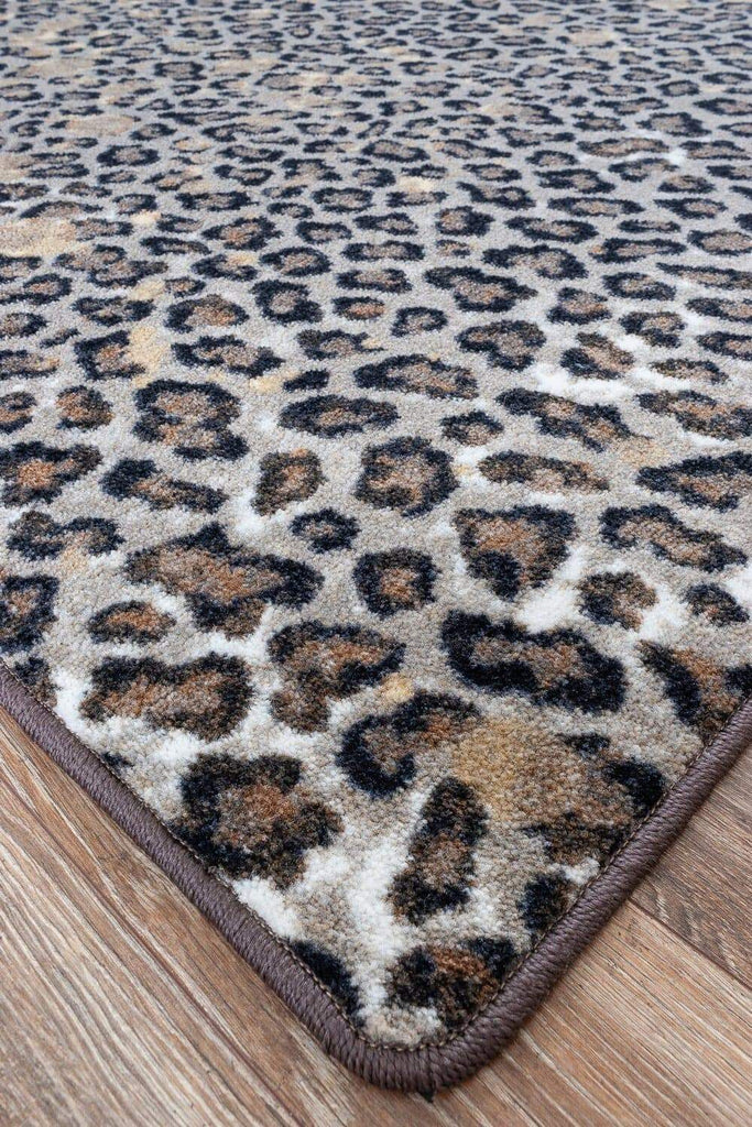 Leopard Print Area Rug with gold accents detail. Made in the USA. Your Western Decor, LLC