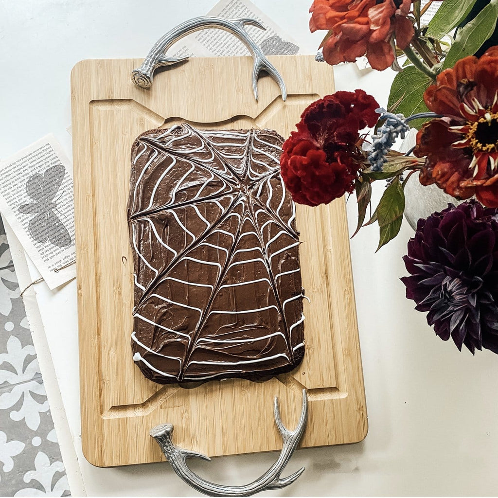Aluminum antler handled carving board with cake - Your Western Decor