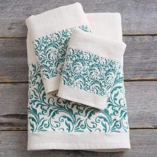 Cream cotton bathroom towel sets with turquoise embroidered scroll work. Your Western Decor