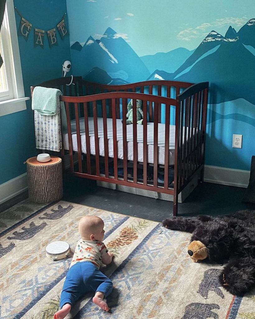 Cabin style decorating baby room with Bear Trails area rug & black bar faux rug - Your Western Decor