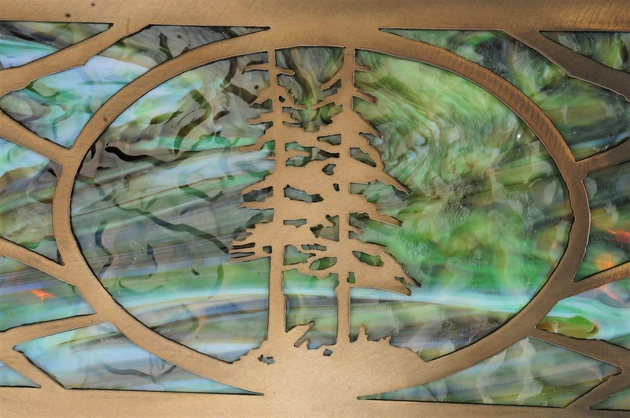 blue dusk, moss green art glass panel under fir tree metal frame. Custom crafted in the USA