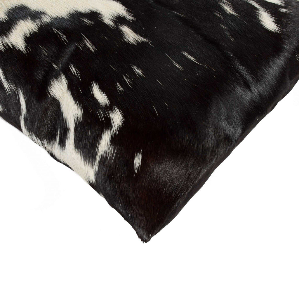 Black and white oblong cowhide accent pillow detail. Handmade. Your Western Decor