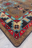 Blue Zircon Southwestern Rug detail in geometric patterns of turquoise, red, beige and black over distressed brown background 