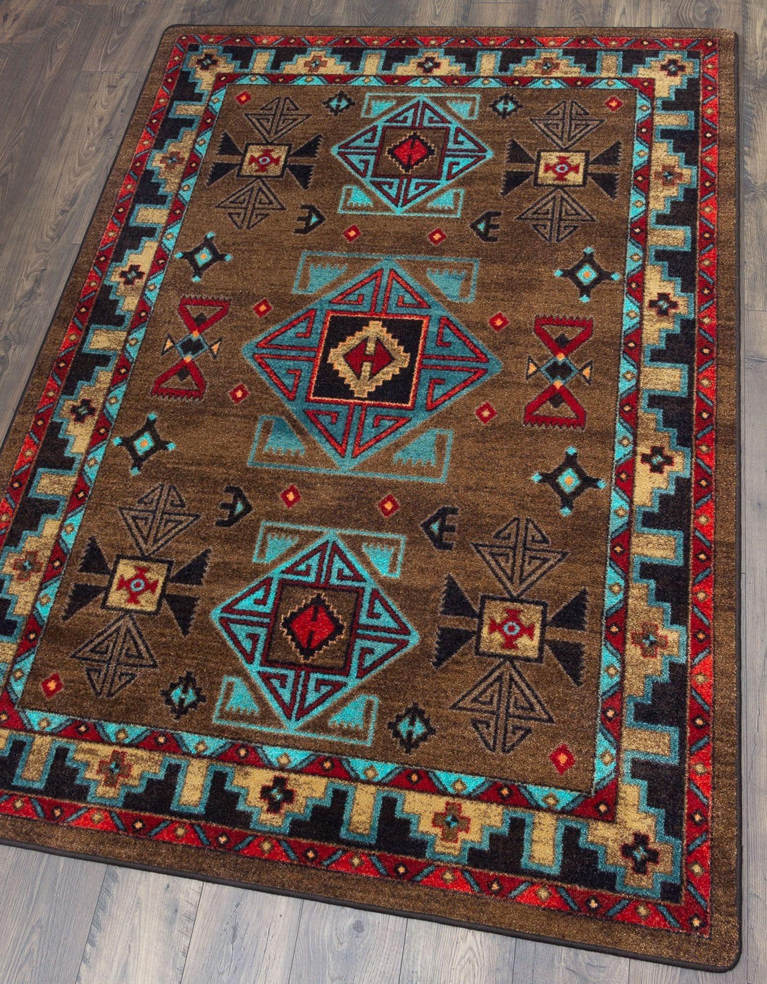 Blue Zircon Southwestern Area Rug in geometric patterns of turquoise, red, beige and black over distressed brown background 