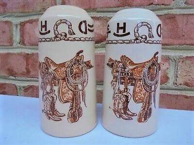 china western salt and pepper shakers printed with boots, saddle, brands & rope. Made in the USA