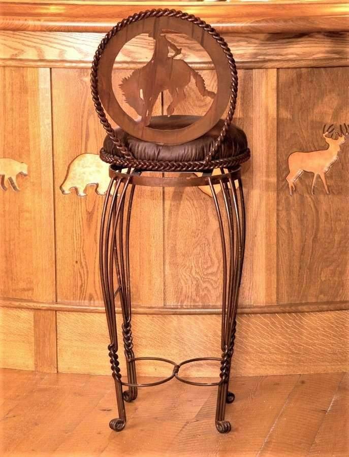 Western hand forged iron bar chairs. Leather seat with bucking bronc cowboy cutout on steel back 