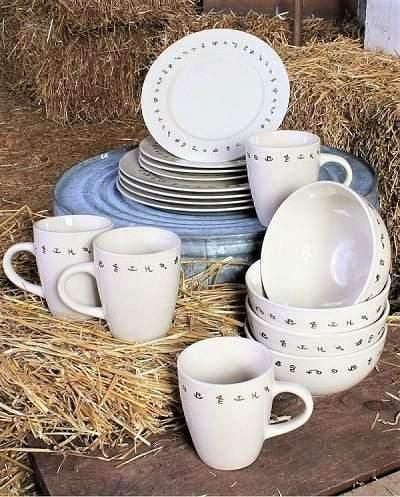 western dinnerware, ivory with brown painted brands sitting on straw bales