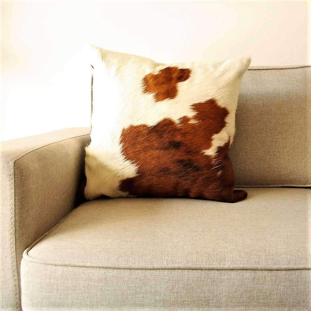 Brown and white cowhide pillow 