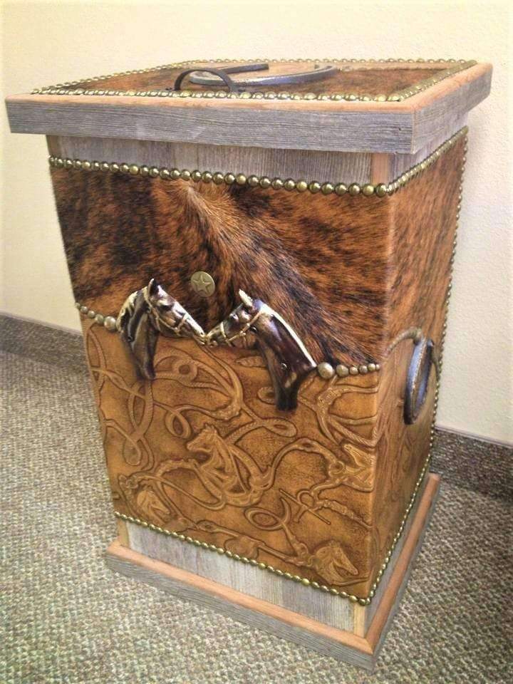 Custom made storage hamper, bin with leather and cowhide coverings and nail head trim. Made in the USA. Your Western Decor