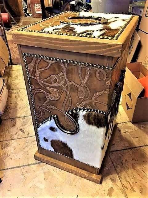 Wood storage hamper with iron features,cowhide and leather upholstery. Made in the USA. Your Western Decor