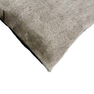 Detail of grey cowhide accent pillow corner 