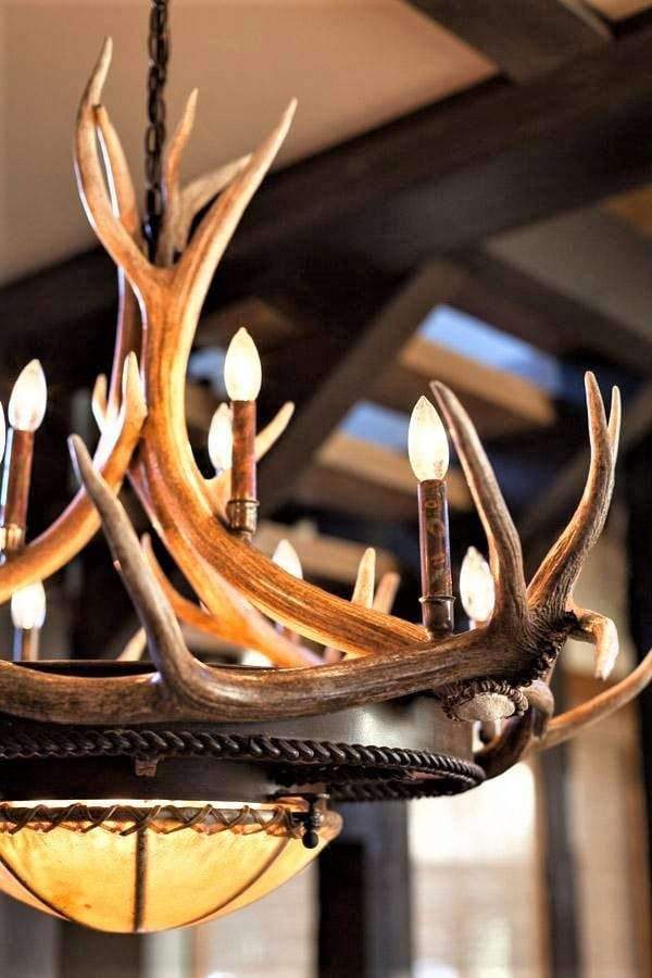 Custom made elk antler chandelier with mica and rawhide shades. Iron frame. 