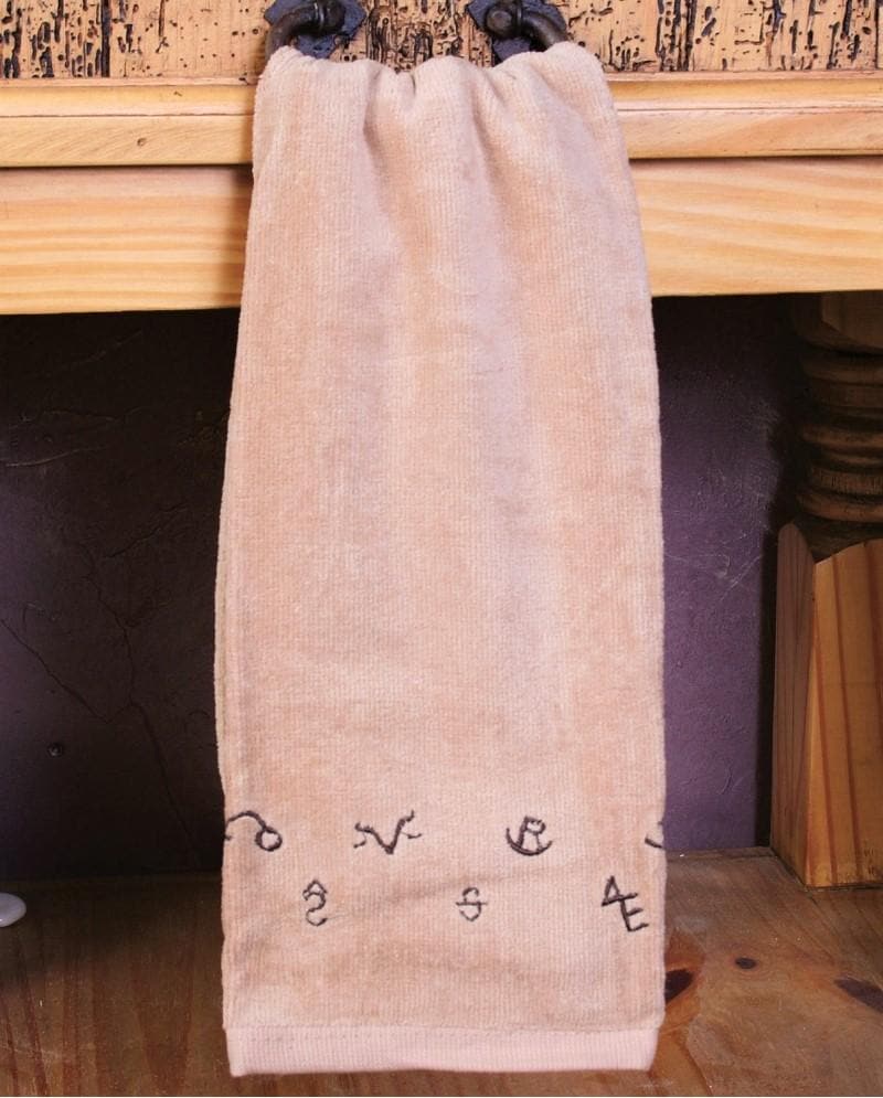 Tan kitchen towel with embroidered brands. Your Western Decor