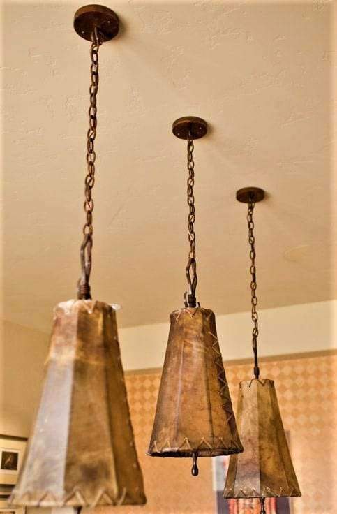 Rustic rawhide hanging lights. Custom made in the USA. Your Western Decor