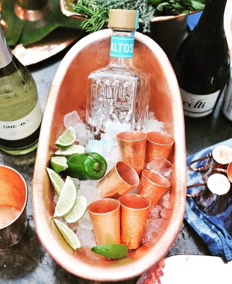 hammered copper cradle ice bucket and shot glasses