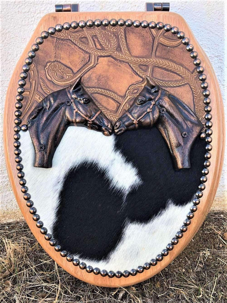 Leather and cowhide toilet seat with iron horses, custom made in the USA. Your Western Decor.