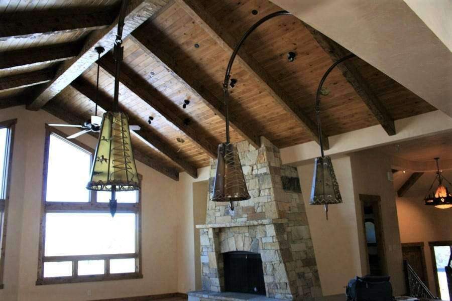 Southwestern rawhide with painted ponies and iron arrow pendant lights. Made in the USA by hand. 