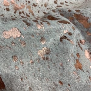 Metallic rose gold acid washed hair on cowhide upholstery - Your Western Decor